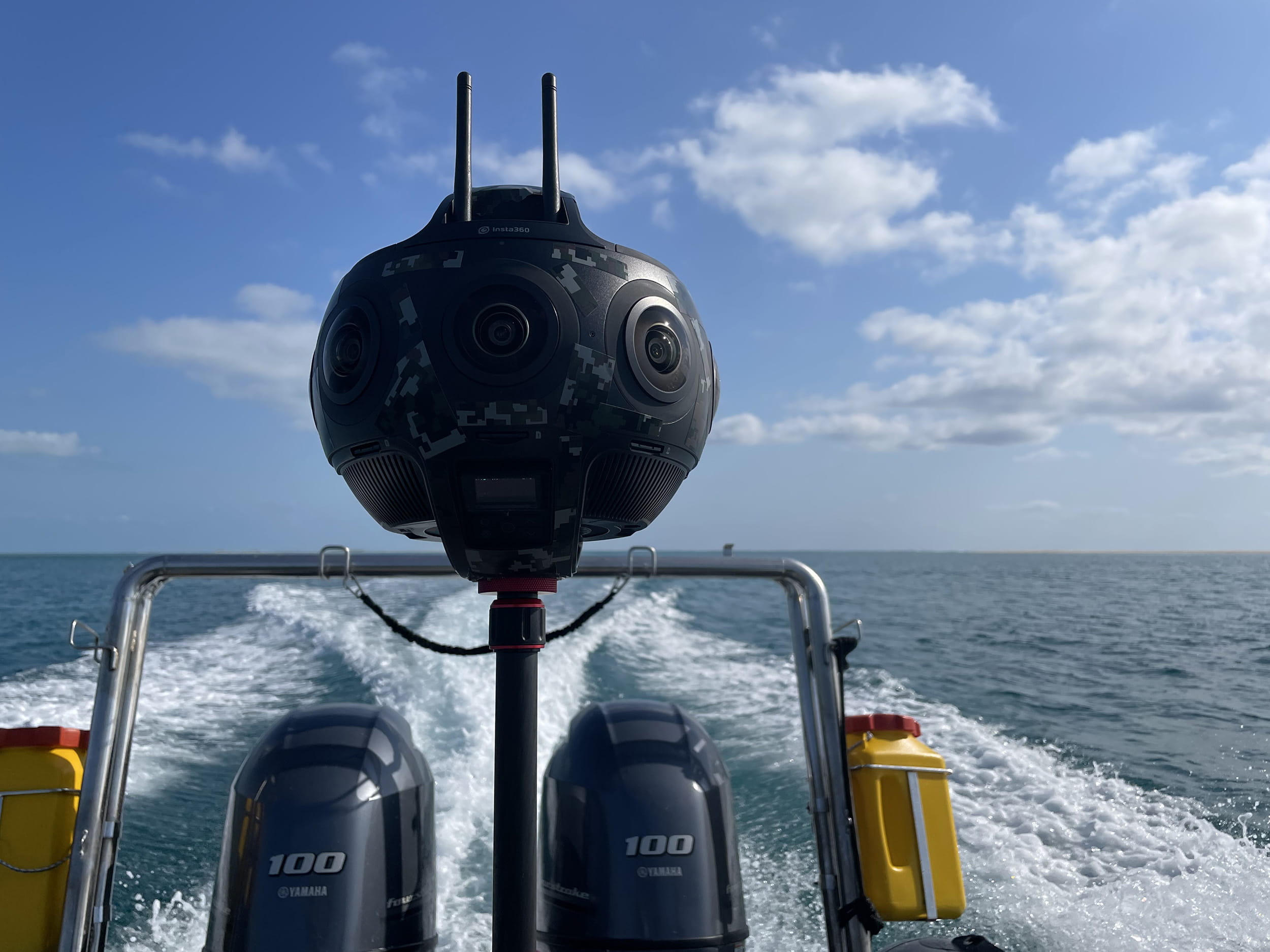 An Insta360 Titan 360-degree camera mounted on a boat, recording immersive ocean footage during marine field operations.